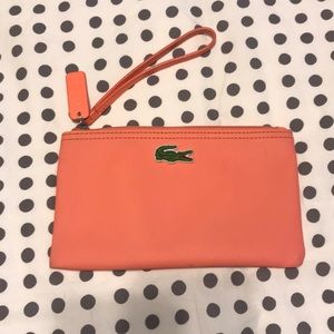 Lacoste coral wristlet